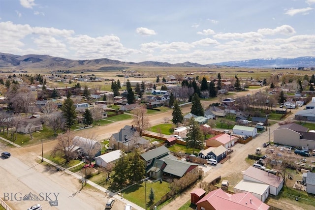 birds eye view of property featuring a mountain view and a residential view
