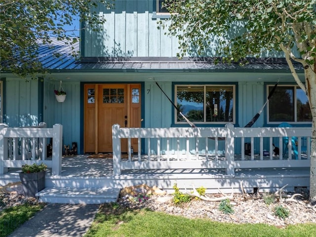 7 Hardy, Ennis, MT 59729 - view of exterior entry with covered porch, board and batten siding, and metal roof