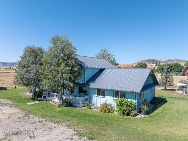 7 Hardy, Ennis, MT 59729 - view of front facade with a front yard and metal roof