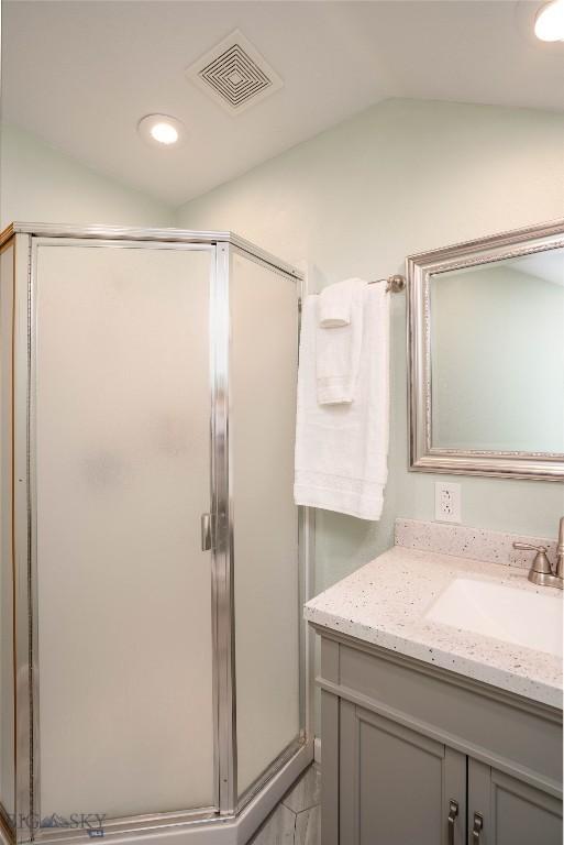 7 Hardy, Ennis, MT 59729 - full bathroom with vaulted ceiling, a stall shower, vanity, and recessed lighting
