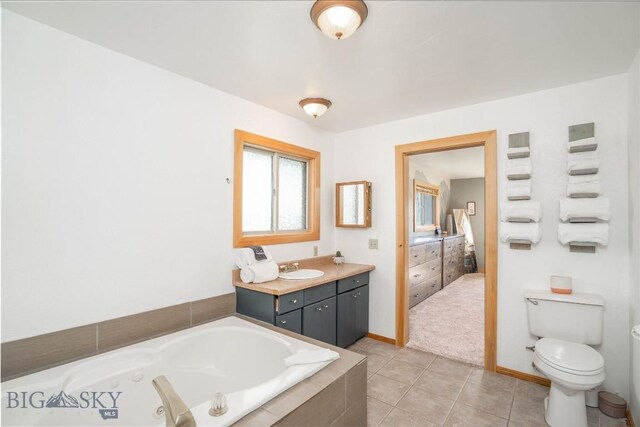 7 Hardy, Ennis, MT 59729 - ensuite bathroom featuring a garden tub, vanity, tile patterned floors, baseboards, and toilet