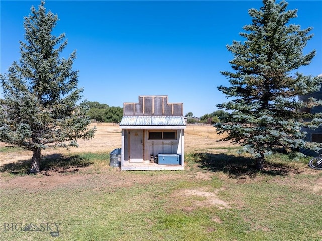 7 Hardy, Ennis, MT 59729 - rear view of property with metal roof and a yard