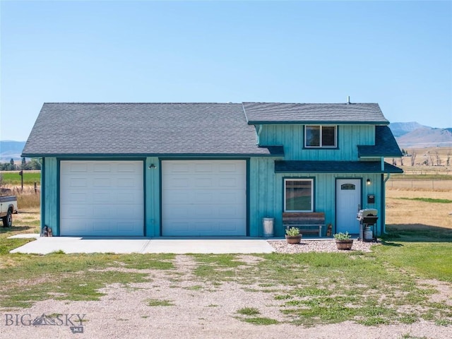 7 Hardy, Ennis, MT 59729 - view of front facade featuring roof with shingles, dirt driveway, and a mountain view