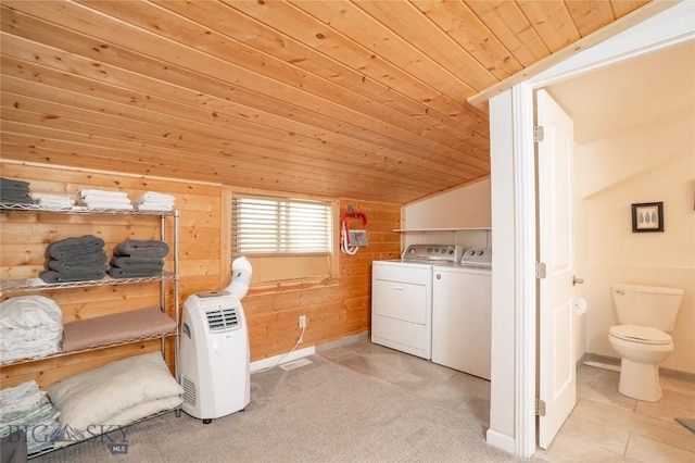 7 Hardy, Ennis, MT 59729 - washroom featuring independent washer and dryer, wood ceiling, wooden walls, light tile patterned floors, and baseboards
