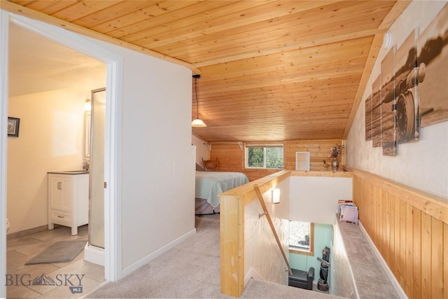 7 Hardy, Ennis, MT 59729 - hall featuring wooden ceiling, an upstairs landing, wood walls, and wainscoting
