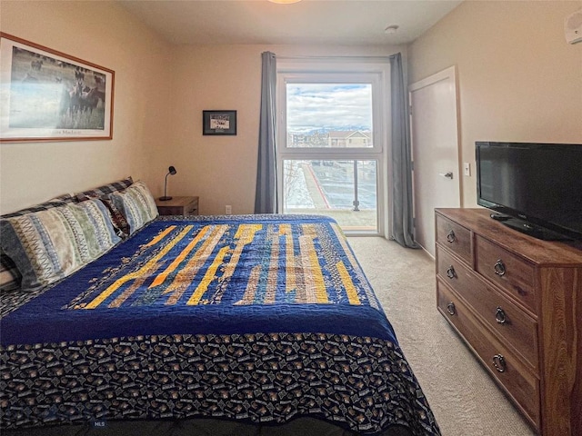 bedroom with light colored carpet