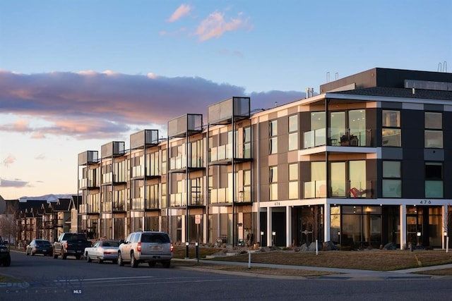 view of outdoor building at dusk