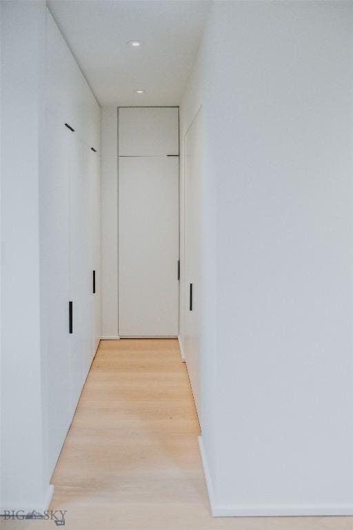 corridor featuring light hardwood / wood-style flooring