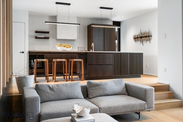 interior space with light hardwood / wood-style flooring and sink