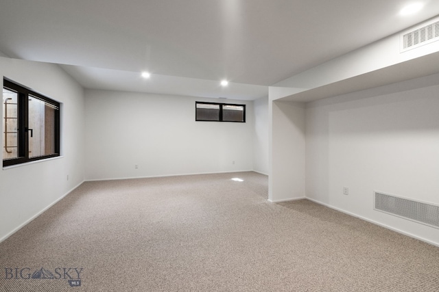 basement with carpet flooring