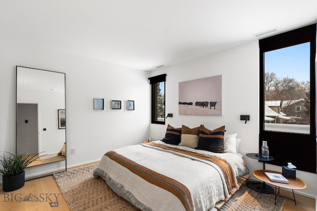 bedroom featuring wood-type flooring