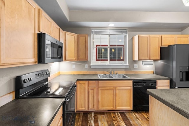 kitchen with light brown cabinetry, sink, black appliances, and dark hardwood / wood-style flooring