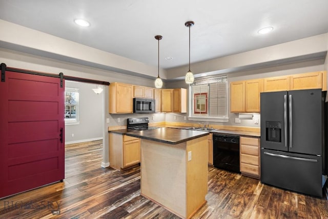 kitchen featuring a barn door, a center island, black appliances, hanging light fixtures, and light brown cabinetry