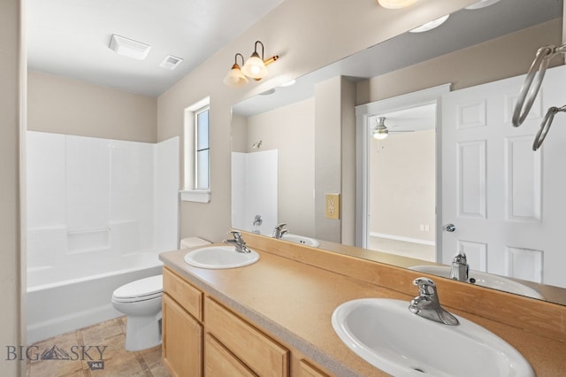 full bathroom with toilet, shower / washtub combination, ceiling fan, tile patterned floors, and vanity