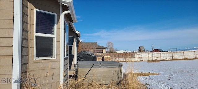 view of home's exterior with fence