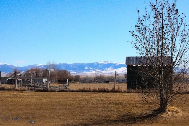 mountain view featuring a rural view