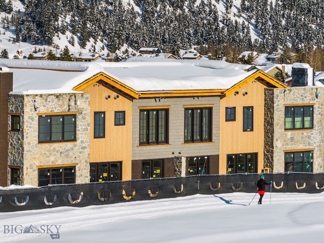 view of snow covered property