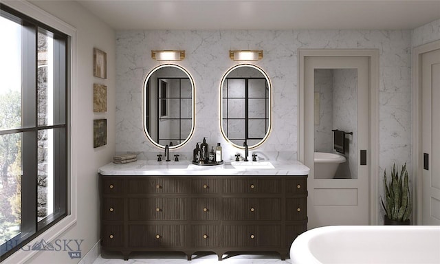 bathroom with a wealth of natural light and vanity