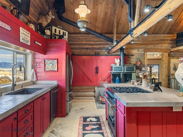 107 Dry Creek Trl, Ennis, MT 59729 - kitchen with a wood stove, red cabinets, a sink, log walls, and wood ceiling