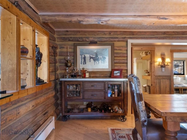 107 Dry Creek Trl, Ennis, MT 59729 - dining area with beamed ceiling, wood finished floors, and log walls