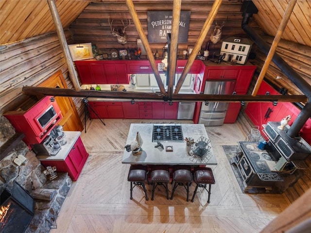 107 Dry Creek Trl, Ennis, MT 59729 - living area featuring vaulted ceiling, hardwood / wood-style floors, wooden ceiling, and rustic walls