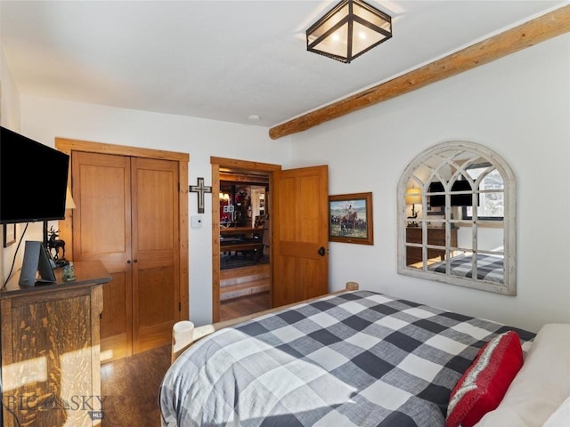 107 Dry Creek Trl, Ennis, MT 59729 - bedroom with beam ceiling, wood finished floors, and a closet
