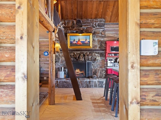 107 Dry Creek Trl, Ennis, MT 59729 - hallway with log walls and wood ceiling
