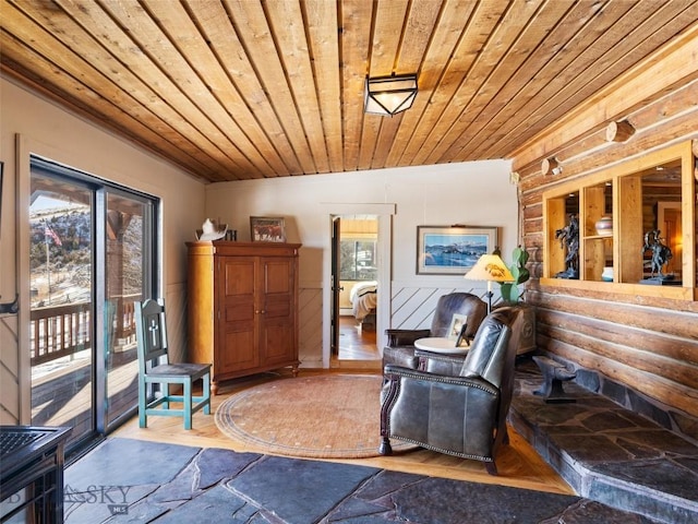 107 Dry Creek Trl, Ennis, MT 59729 - living area with wooden ceiling, plenty of natural light, wood finished floors, and wainscoting