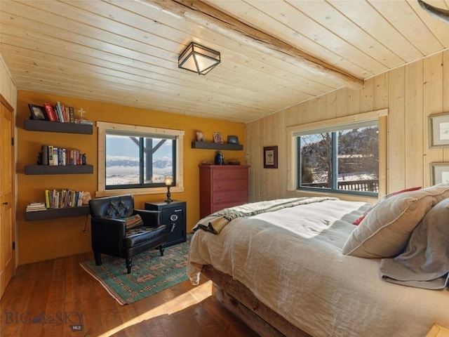 107 Dry Creek Trl, Ennis, MT 59729 - bedroom with wood ceiling, wooden walls, hardwood / wood-style floors, and lofted ceiling