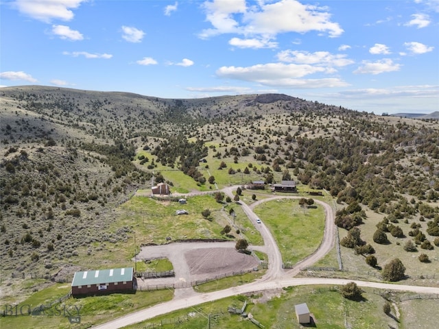 107 Dry Creek Trl, Ennis, MT 59729 - aerial view of property and surrounding area featuring a mountain backdrop and rural landscape