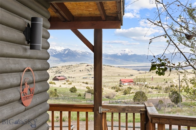 107 Dry Creek Trl, Ennis, MT 59729 - wooden deck with a mountain view and a view of rural / pastoral area