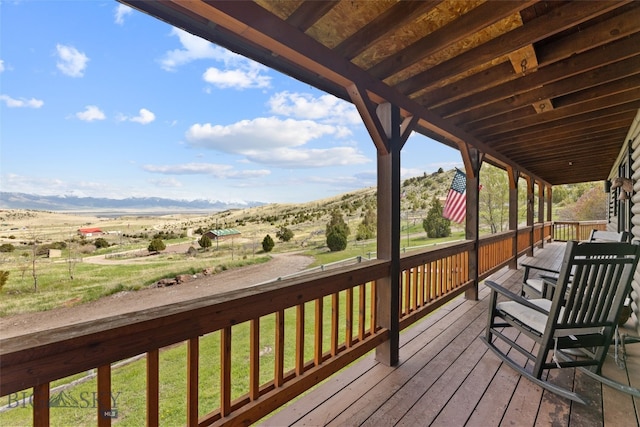 107 Dry Creek Trl, Ennis, MT 59729 - deck with a mountain view, a lawn, and a view of countryside