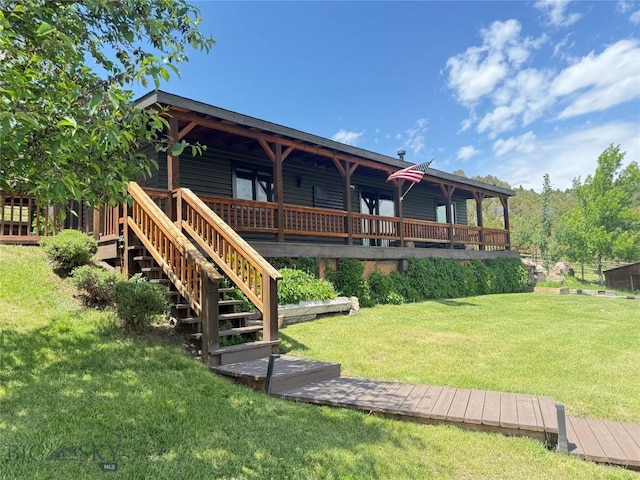 107 Dry Creek Trl, Ennis, MT 59729 - back of house featuring a lawn and a wooden deck