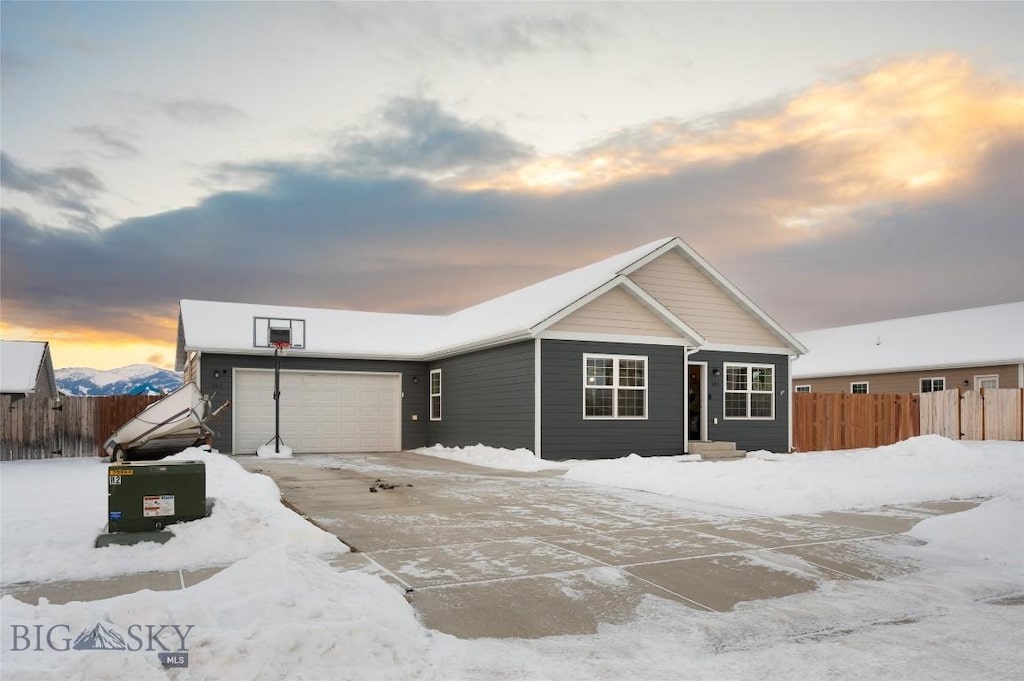 ranch-style house featuring a mountain view and a garage