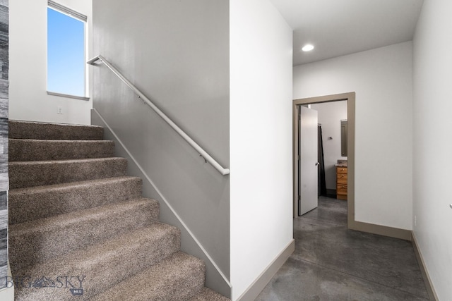 stairway with concrete floors