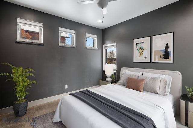 bedroom with ceiling fan and carpet