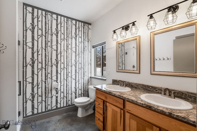 bathroom with toilet and vanity