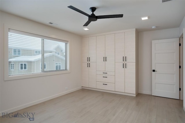 unfurnished bedroom featuring light hardwood / wood-style floors and ceiling fan