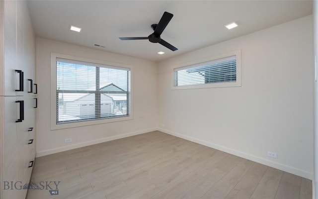 unfurnished room with ceiling fan and light hardwood / wood-style floors