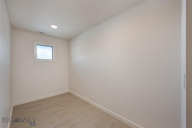 unfurnished room with light hardwood / wood-style floors