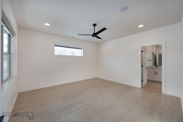 unfurnished room with ceiling fan, light hardwood / wood-style flooring, and a healthy amount of sunlight