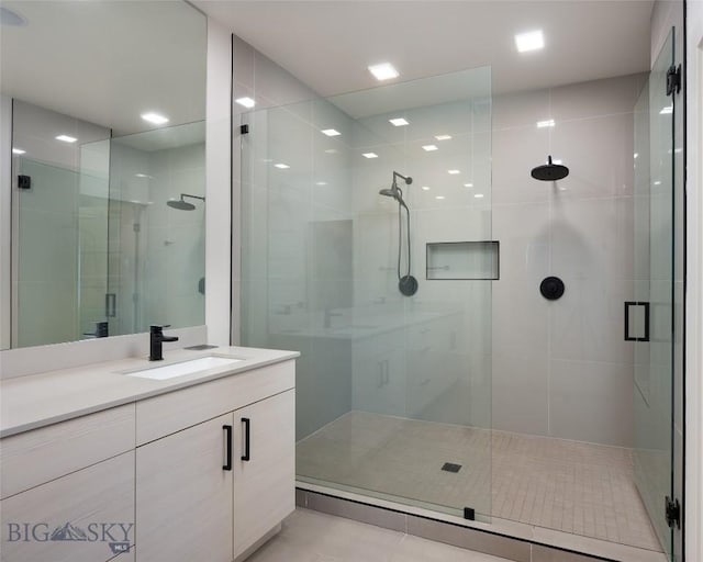 bathroom featuring vanity and walk in shower