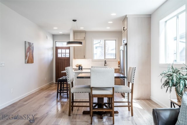 dining area with light hardwood / wood-style flooring