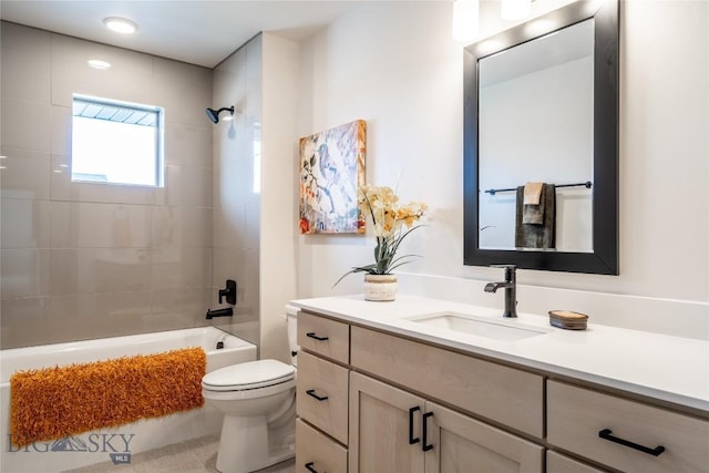 full bathroom with tiled shower / bath combo, vanity, and toilet