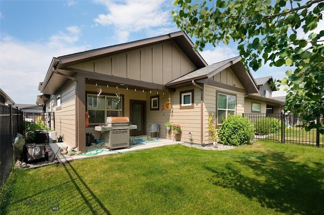 rear view of house with a yard