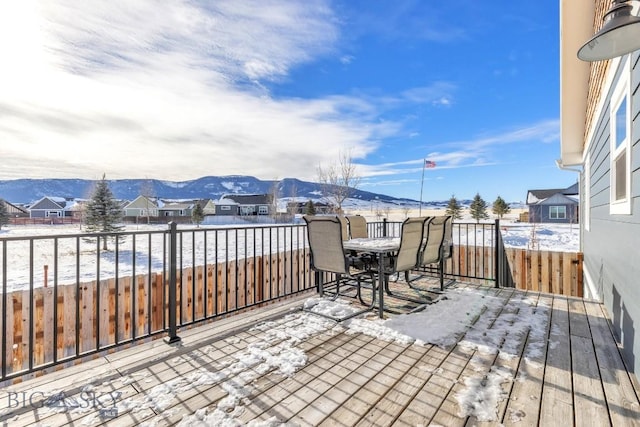 snow covered patio featuring a mountain view