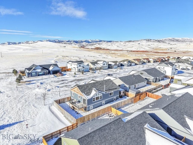 snowy aerial view with a mountain view