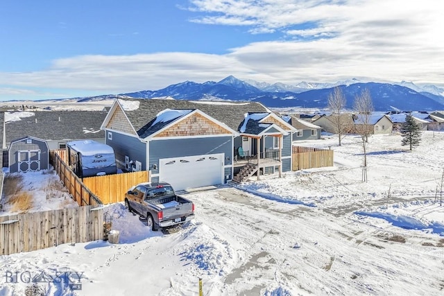 view of front of house featuring a garage and a mountain view