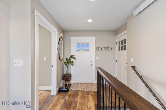 entryway with dark hardwood / wood-style floors