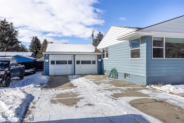 view of snow covered garage